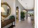 Inviting foyer with tile flooring, arched doorways, and an elegant mirror that adds a touch of sophistication at 8715 52Nd E Ave, Bradenton, FL 34211