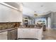 Charming kitchen with white cabinetry, granite countertops, stainless steel appliances, and tile backsplash at 8715 52Nd E Ave, Bradenton, FL 34211