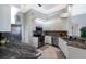 Modern kitchen featuring stainless steel appliances, granite countertops, and ample cabinet space at 8715 52Nd E Ave, Bradenton, FL 34211