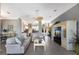 Open floorplan living room with sofas, ceiling fan and built in entertainment center at 8715 52Nd E Ave, Bradenton, FL 34211