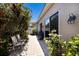 Landscaped outdoor patio features shaded seating and a gas grill at 8715 52Nd E Ave, Bradenton, FL 34211