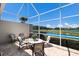 Screened patio offers a scenic view of the community golf course and lake at 8715 52Nd E Ave, Bradenton, FL 34211