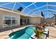 Private screened pool with patio provides a relaxing outdoor space adjacent to the home at 8715 52Nd E Ave, Bradenton, FL 34211