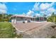 Home's exterior has a brick patio with a screened-in porch perfect for outdoor living and entertaining at 9080 Caloosa Dr, Venice, FL 34293