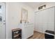 Laundry room featuring a sink, white cabinets, and closet for extra storage at 9080 Caloosa Dr, Venice, FL 34293