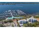 Aerial view featuring a harbor with docked boats and a waterfront building complex at 1000 Riverside Dr # B501, Palmetto, FL 34221