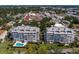 Aerial view of two modern residential buildings featuring swimming pool and manicured lawns at 1000 Riverside Dr # B501, Palmetto, FL 34221