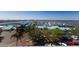Aerial view of marina featuring boat slips, docks, waterways, restaurant, and surrounding parking areas at 1000 Riverside Dr # B501, Palmetto, FL 34221