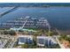 Aerial view of marina with boats docked and condos near the water and bridge views at 1000 Riverside Dr # B501, Palmetto, FL 34221