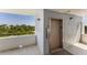 Hallway features an elevator and a view of the outside with tile floors at 1000 Riverside Dr # B501, Palmetto, FL 34221