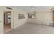 Unfurnished living room with vintage wallpaper and an open pass-through to the kitchen at 1000 Riverside Dr # B501, Palmetto, FL 34221