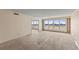 Spacious living room with expansive windows offering waterfront views at 1000 Riverside Dr # B501, Palmetto, FL 34221