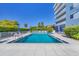 Inviting community pool area with clear blue water, lounge chairs, and well-maintained landscaping at 1000 Riverside Dr # B501, Palmetto, FL 34221