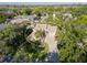 Beautiful aerial view showcases the home's setting amongst lush landscaping in a tranquil neighborhood at 1016 91St Nw St, Bradenton, FL 34209