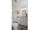 Bathroom featuring vanity with granite countertop, framed mirror, and art piece at 1016 91St Nw St, Bradenton, FL 34209