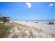 Expansive beach with a lifeguard tower, inviting turquoise waters, and soft white sand at 1016 91St Nw St, Bradenton, FL 34209