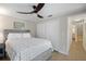 Neutral bedroom with a ceiling fan, plank floors, and a double closet at 1016 91St Nw St, Bradenton, FL 34209
