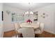 Dining room with hardwood floors, chandelier, and a view to the kitchen at 1016 91St Nw St, Bradenton, FL 34209