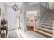 Elegant entryway features a staircase, stylish lighting, and access to the dining area at 1016 91St Nw St, Bradenton, FL 34209