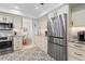 Modern kitchen with stainless steel appliances, granite countertops, and custom cabinetry at 1016 91St Nw St, Bradenton, FL 34209