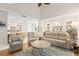 Comfortable living room featuring an open layout, access to other rooms, and hardwood flooring at 1016 91St Nw St, Bradenton, FL 34209