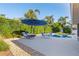Outdoor seating area with lounge chairs and a table situated next to the refreshing swimming pool at 1016 91St Nw St, Bradenton, FL 34209