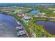 Overhead view of the River Club, marina, golf course, lake, and neighborhood, with lush Florida vegetation at 10411 Winding Stream Way, Bradenton, FL 34212
