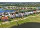 Aerial view of homes near the golf course surrounded by lush landscapes and waterways at 10411 Winding Stream Way, Bradenton, FL 34212