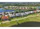 Aerial view of homes near the golf course surrounded by lush landscapes and waterways at 10411 Winding Stream Way, Bradenton, FL 34212