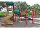 Vibrant community playground featuring slides, climbing structures, and a safe, soft surface for children to enjoy outdoor play at 10411 Winding Stream Way, Bradenton, FL 34212