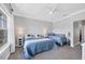 Bright bedroom with two beds, large window for natural light, and neutral tones at 10720 Lemon Creek Loop # 103, Englewood, FL 34224