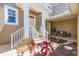 Inviting covered front porch with seating and garden area at 10720 Lemon Creek Loop # 103, Englewood, FL 34224