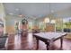 Community game room features a pool table and seating at 10720 Lemon Creek Loop # 103, Englewood, FL 34224