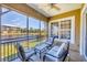 Relaxing screened lanai with comfortable seating and a beautiful lake view at 10720 Lemon Creek Loop # 103, Englewood, FL 34224
