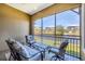 Serene screened lanai providing picturesque water views and outdoor seating at 10720 Lemon Creek Loop # 103, Englewood, FL 34224