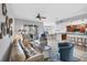 Spacious living room with large sliding doors, neutral decor, and an open view to the kitchen at 10720 Lemon Creek Loop # 103, Englewood, FL 34224