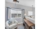 Cozy sitting area with natural light from two windows and neutral tones at 10720 Lemon Creek Loop # 103, Englewood, FL 34224
