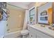 Traditional bathroom includes a shower-tub combo and a single sink vanity at 108 Stanford Rd, Venice, FL 34293