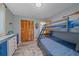Bedroom with bunk beds, light gray walls and wood look floors at 108 Stanford Rd, Venice, FL 34293