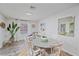 Dining area boasts natural light and features a nautical decor with warm design accents at 108 Stanford Rd, Venice, FL 34293