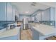 Well-equipped kitchen with stainless steel appliances, blue backsplash, and ample counter space at 108 Stanford Rd, Venice, FL 34293