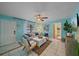 Cozy living room with tile flooring, comfortable furniture, and access to other areas of the home at 108 Stanford Rd, Venice, FL 34293