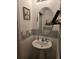 A charming powder room with a decorative mirror and a pedestal sink at 1118 Wynnmere Walk Ave, Ruskin, FL 33570