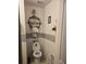 A quaint powder room with a toilet and decorative shelves and figurines at 1118 Wynnmere Walk Ave, Ruskin, FL 33570