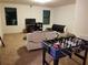 A versatile living room is decorated with a foosball table and dual couches at 1118 Wynnmere Walk Ave, Ruskin, FL 33570