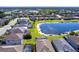 An aerial shot of homes bordering a lake showcasing lush landscaping and serene backyard pools at 11510 Sweetgrass Dr, Bradenton, FL 34212