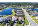 An aerial view shows a luxury neighborhood with lakefront property at 11510 Sweetgrass Dr, Bradenton, FL 34212