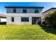 The lush, grassy backyard offers a perfect outdoor space, framed by the home's rear exterior at 11510 Sweetgrass Dr, Bradenton, FL 34212