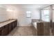 Bathroom featuring double vanity, granite countertops, soaker tub and tiled shower at 11510 Sweetgrass Dr, Bradenton, FL 34212
