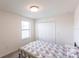 Bright bedroom features neutral walls, a large closet, and a window for ample natural light at 11510 Sweetgrass Dr, Bradenton, FL 34212